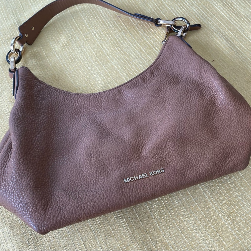 Like new Michael Kors Medium size leather hand bag.